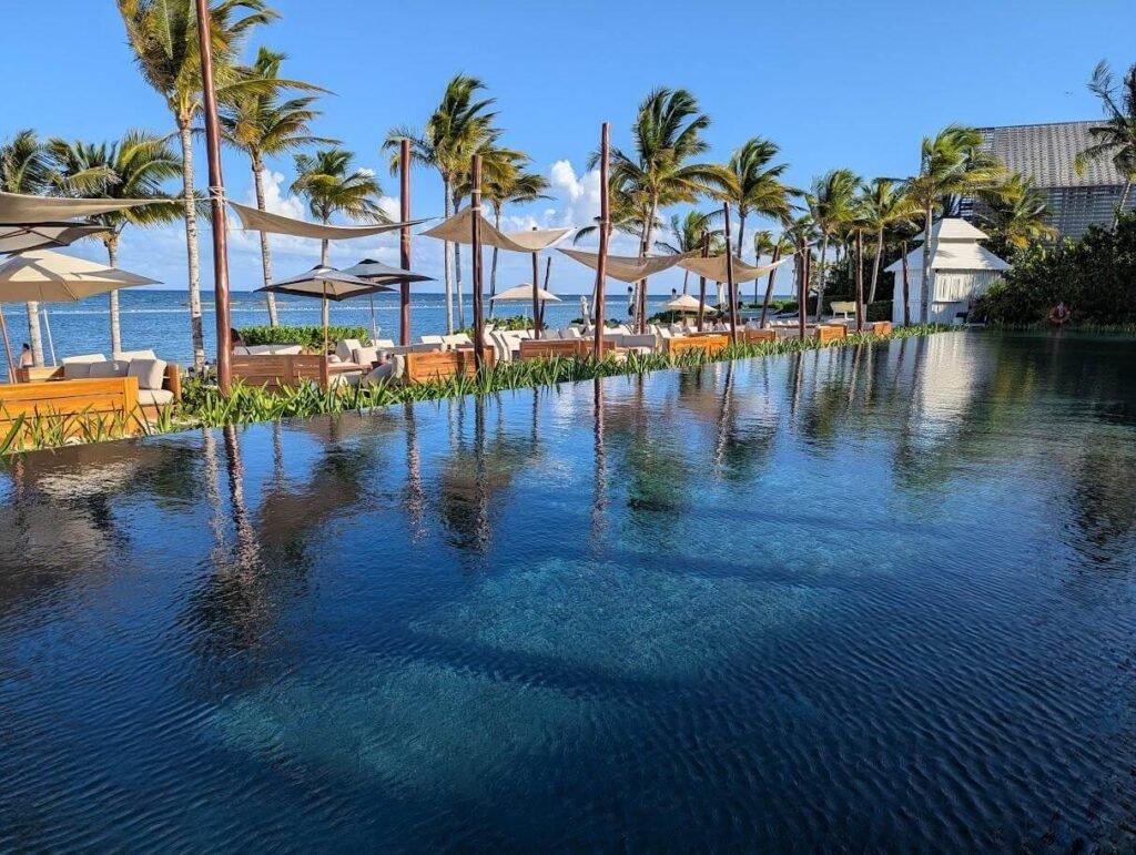 Large swimming pool with palm trees at Banyan Tree