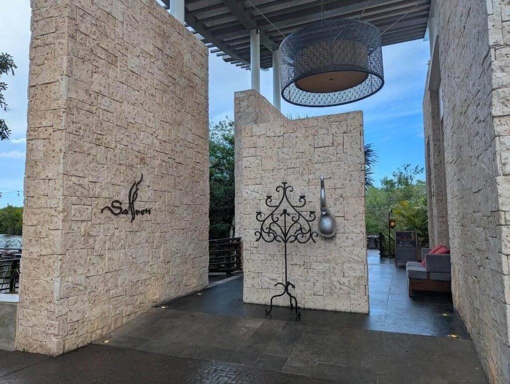 Stone walls with hanging light fixture at Banyan